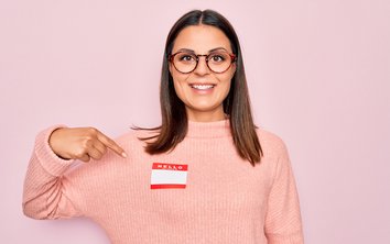 Woman points to her name tag